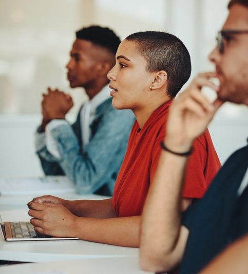 Students paying attention to lecture in classroom.